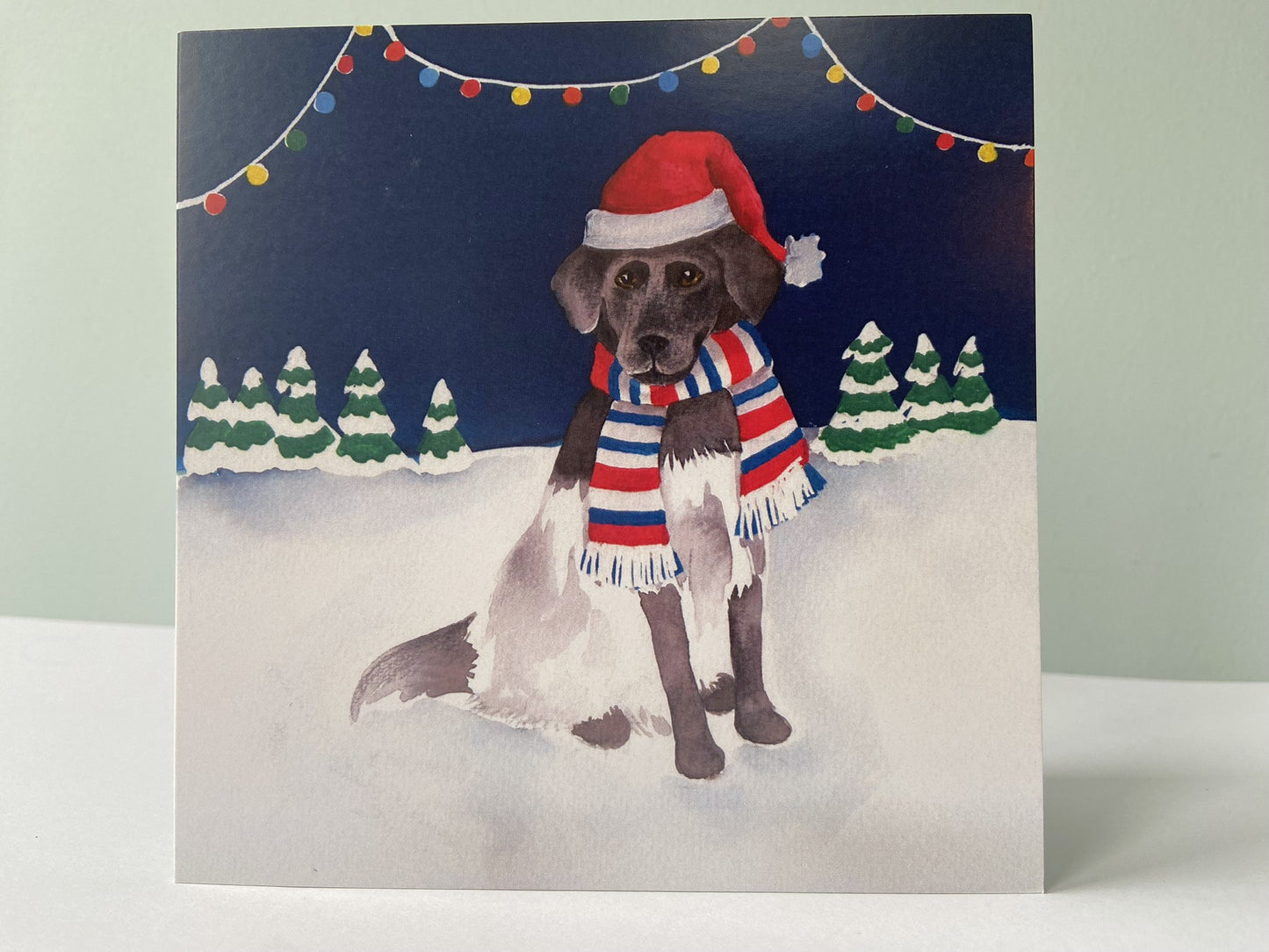Kerstkaart Hond in de sneeuw